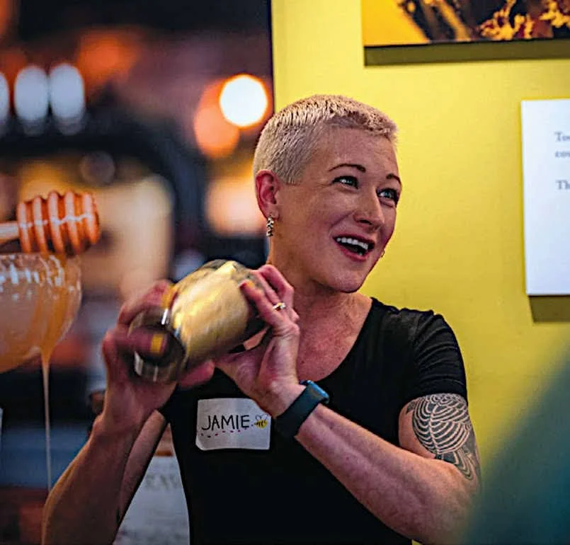 Beverage Director Jamie Pessoa Monteiro shaking a cocktail behind the bar